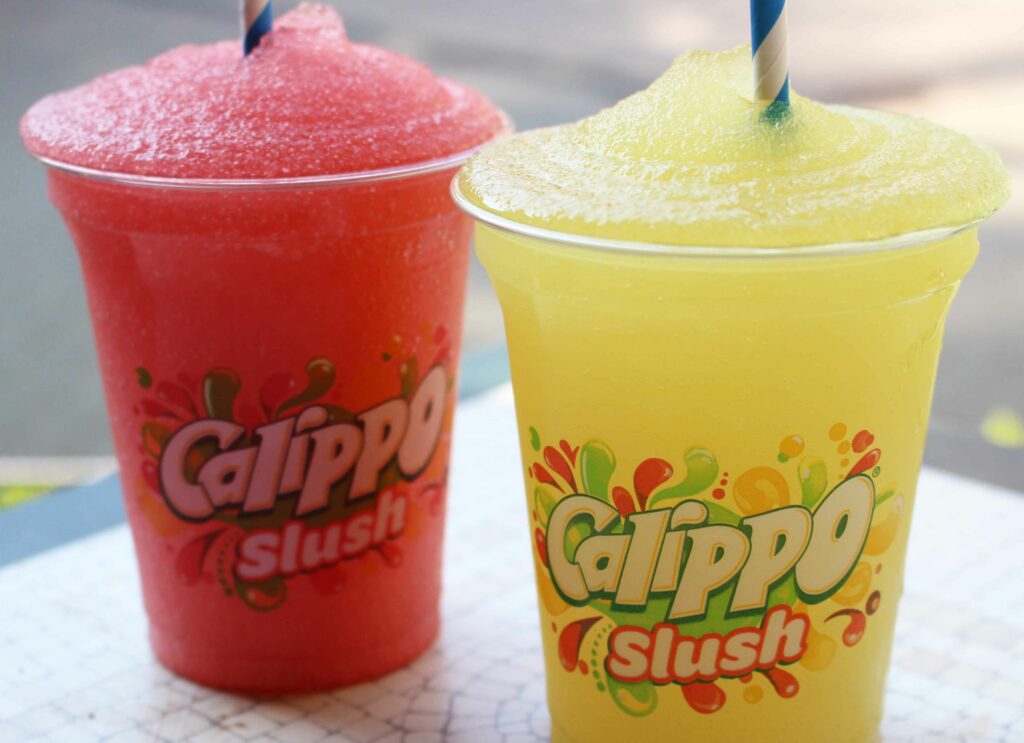 Red and yellow slush drinks on a table
